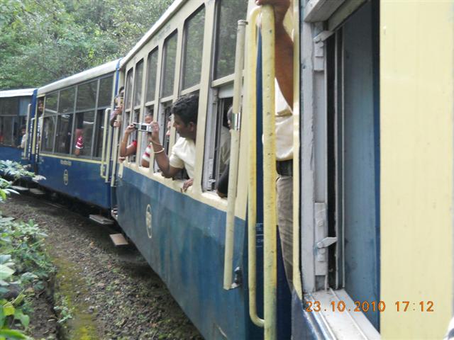 People Clicking Pictures While Riding the Train
